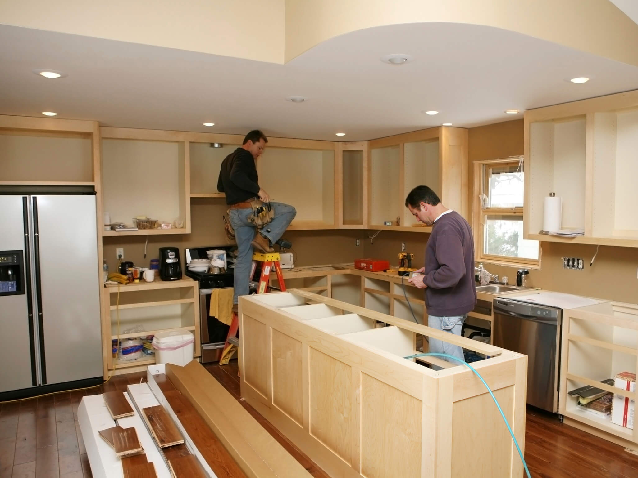 Idaho home with contractors renovating kitchen